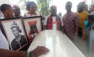 Pa Ubani Agbedubi Nwokocha lying in state and flanked by his son and daughter-in-law Bar. and Mrs. Monday Ubani (M), Comrd. Maxwell Uzochukwu Kingsley CEO of Max Digital Source (1st-R) and other relatives.