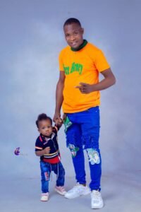 Comrd. (Engr.) Promise Chidiebere Ezekiel and his one-year-old first son, Prince Chizazirim Promise